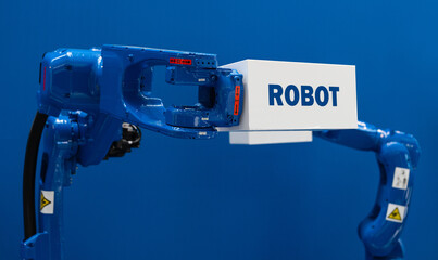 Robot arm with box and text ROBOT. Smart industry concept	