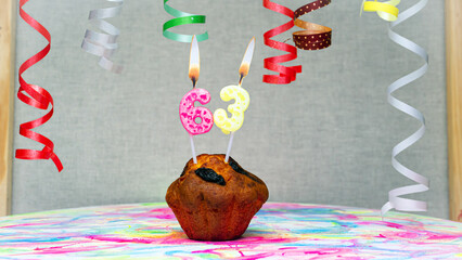 Happy birthday background with muffin with beautiful decorations with number candles  63. Colorful festive card happy birthday with a number. Anniversary copy space