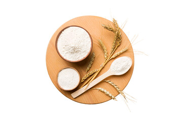 Flat lay of Wheat flour in wooden bowl with wheat spikelets isolated on white background. world wheat crisis
