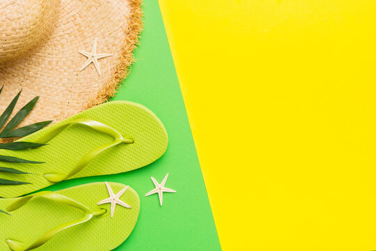 Summer vacation concept flat lay. straw hat beach accessories and flip flop top view. Space for text. travel concept