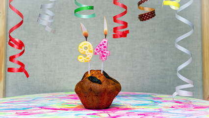 Happy birthday background with muffin with beautiful decorations with number candles  94. Colorful...