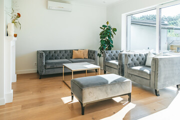 Cozy living room with big window and elegant sofas