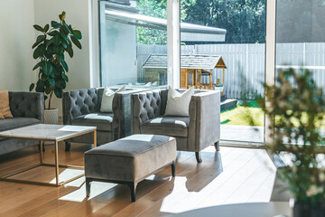 Cozy living room with elegant sofas and big window