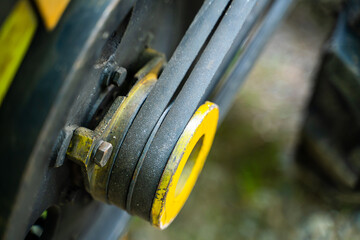 Walk-behind tractor pulley with two belts close-up. Tractor for agriculture, agricultural machinery