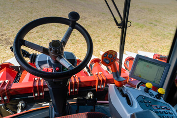 Autonomous combine harvester working on the field. Smart farming	
