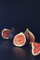 Ripe juicy figs in low key