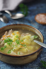 A bowl with chicken soup with pasta	