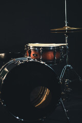Obraz na płótnie Canvas Drums on a dark background, part of a drum kit.