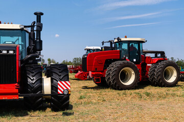 Agricultural tractors on a field