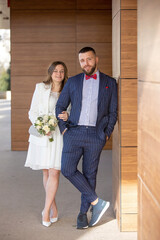 Young newlywed couple, having pictures taken on their wedding