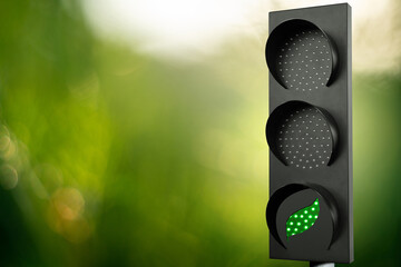 Traffic light with green leaf symbol. Decarbonization concept	