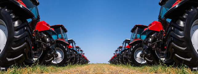 Agricultural tractors on a field