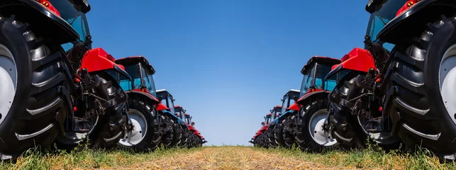 Deurstickers Agricultural tractors on a field © scharfsinn86