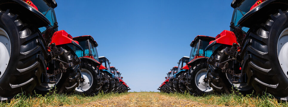 Fototapeta Agricultural tractors on a field