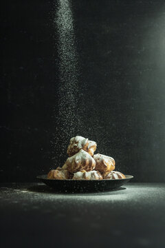 cookies and cake on a dark black background
