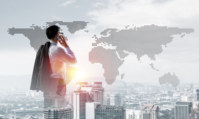 Concept of business success and control with confident boss against cityscape background