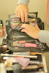 The work of a makeup artist near the makeup table with tools