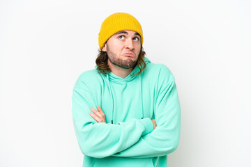 Young handsome man isolated on white chroma background making doubts gesture while lifting the shoulders