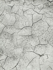 Dry, cracked earth, top view for background or graphic design with drought concept.