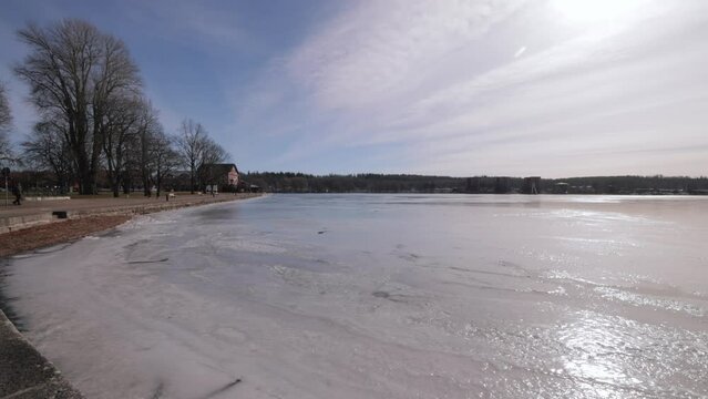 Panorama Of A Frozen Lake During Winter In Motala, Sweden. Wide Shot