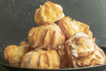 cookies and cake on a dark black background
