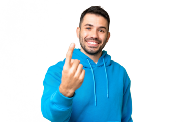 Young handsome caucasian man over isolated chroma key background doing coming gesture