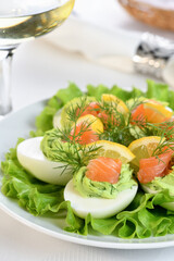 Eggs stuffed with avocado, salmon and lemon. The perfect appetizer for your holiday table.