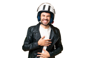 Young caucasian man with a motorcycle helmet over isolated chroma key background smiling a lot