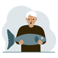 A old male fisherman holds a large fish, proud of good fishing or hunting. Hobby, fishing concept.