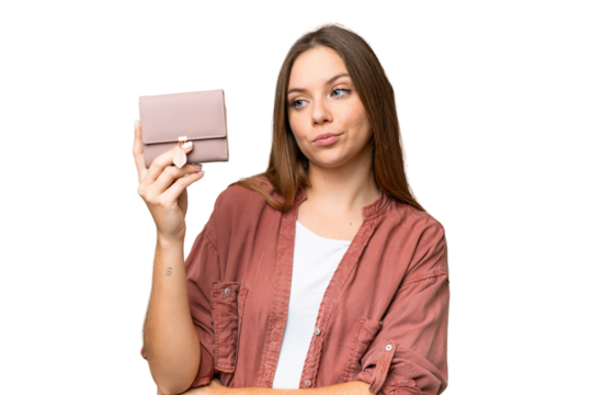 Young blonde woman holding a wallet over isolated chroma key background with sad expression
