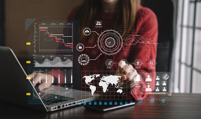 Woman hand Project manager working and update tasks and Gantt chart scheduling virtual diagram.with smart phone, tablet and laptop in office.