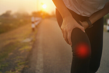 Ankle knee accident in sport exercise running jogging.low key lighting.