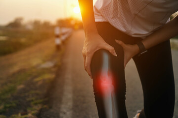 Ankle knee accident in sport exercise running jogging.low key lighting.