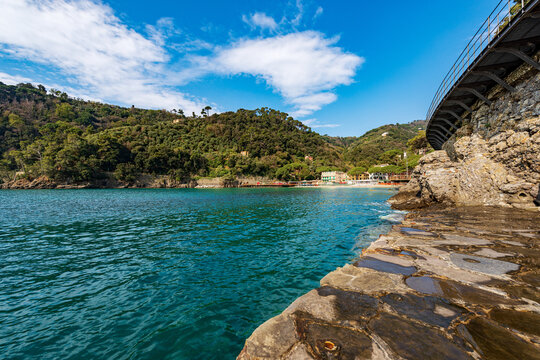 Bay and beach of Paraggi near the Portofino village. Tourist resort in Genoa Province (Genova), Liguria, Italy, Europe. Coast and Mediterranean Sea (Ligurian Sea).
