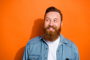 Closeup photo of optimistic young irish guy redhair smiling look empty space satisfied opening barbershop promo isolated on orange color background