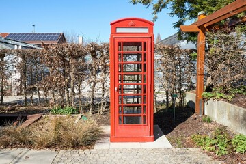 Red telephone cabin in Augsburg, Germany