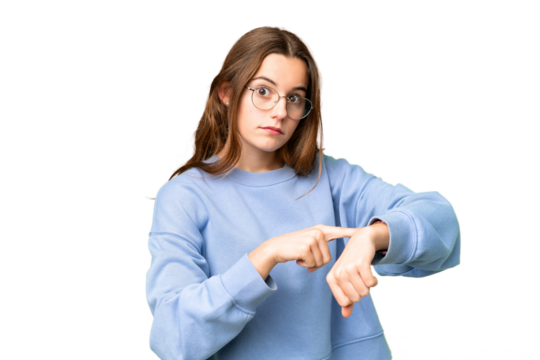 Teenager girl over isolated chroma key background making the gesture of being late