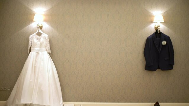 Wedding dress and Men's suit standing on the wall. 