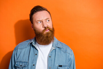 Fototapeta premium Portrait of minded uncertain young guy look empty space decide interested thoughts isolated on vivid color background