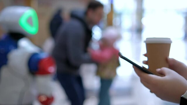 Young woman using smartphone at mall. Caucasian girl looking at mobile phone in her hand. Communication, work or study, connection, mobile apps, technology, lifestyle concept 4K