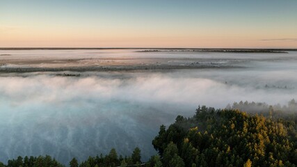 Drone shot of a lake with a little morning mist