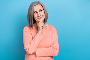Photo of deep thinking girl grey hair wear peachy shirt touch chin intelligent look empty space...