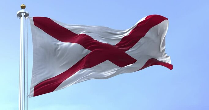 Seamless loop in slow motion of Alabama state flag waving in the wind