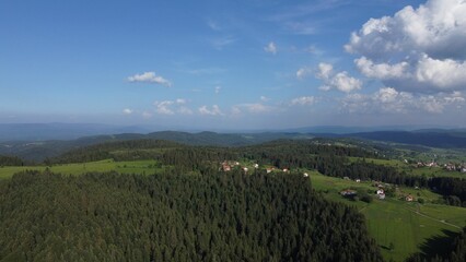 Aerial drone view of beautiful green forests and farmlands in Bosnia and Herzegovina