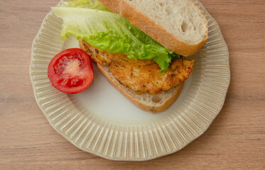 Fried chicken and lettuce between two slices of bread. healthy fresh sandwich.