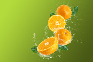 Creative layout made from oranges and Orange fruit and water Splashing on a green background.
