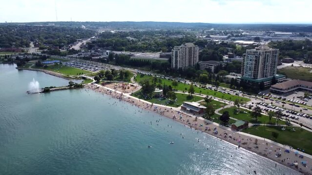 Aerial footage of a crowdy coastline of Lake Simcoe and Kempenfelt bay in Barrie, Ontario