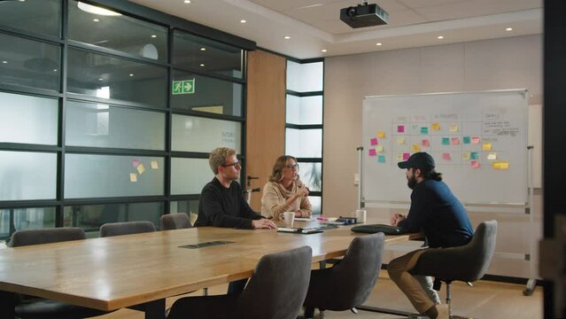 Group of business people having a discussion in a boardroom