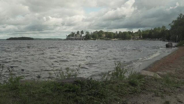 Footage of Muskoka Lake in Gravenhurst, Canada in cloudy sky background