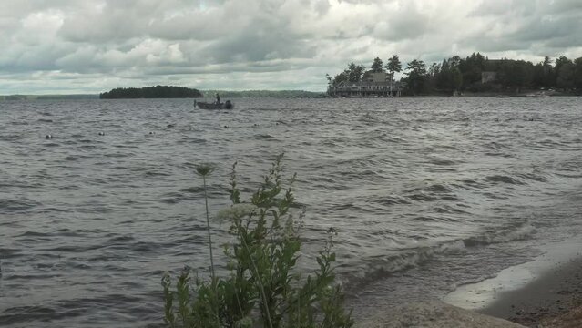 Footage of Muskoka Lake in Gravenhurst, Canada in cloudy sky background